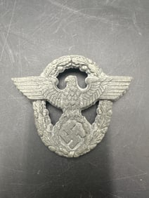WWII German Police Hat Badge with Eagle and Wreath Design