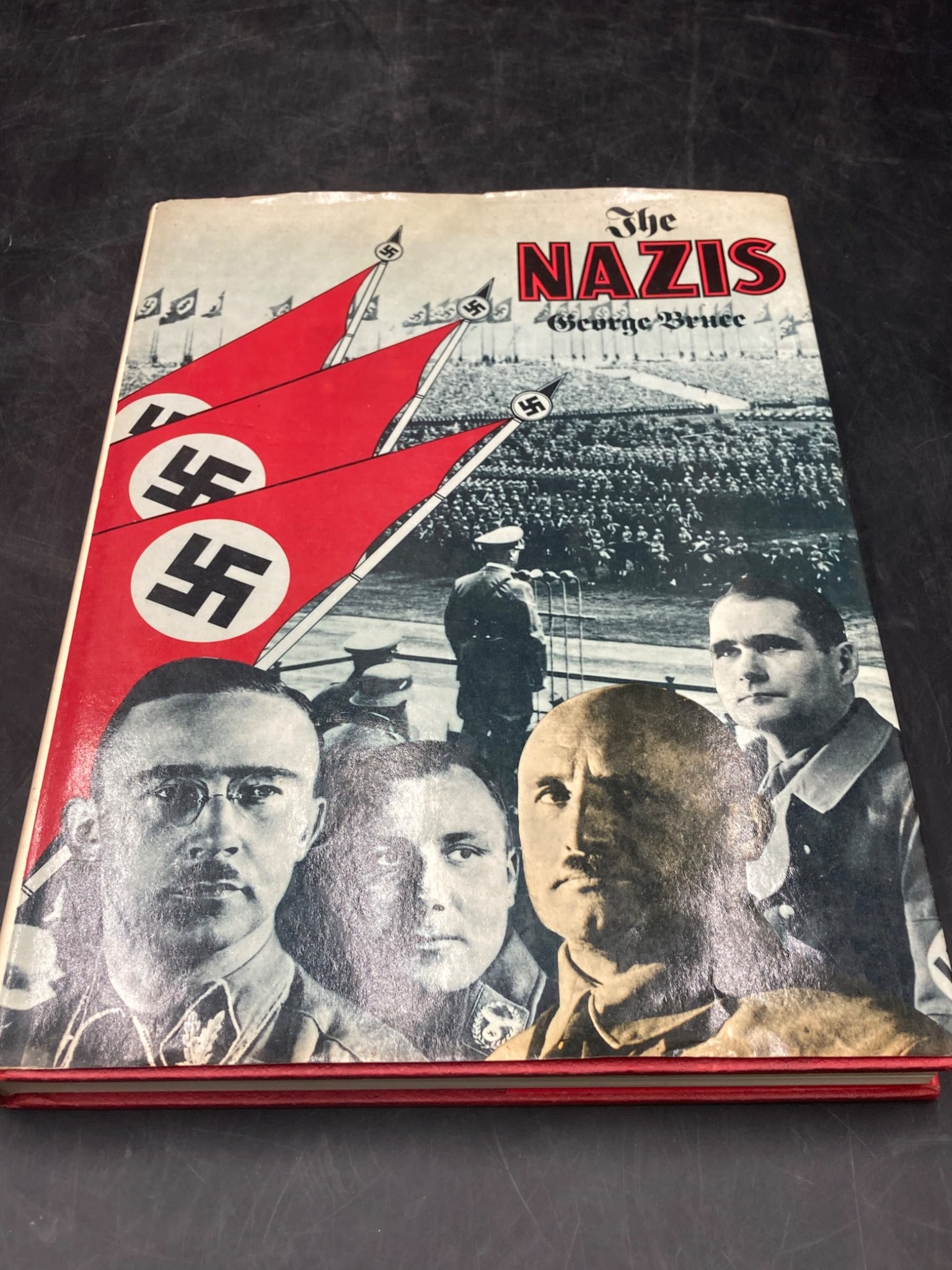 The Nazis By George Bruce: Historical Volume with Illustrations: This lot includes the book titled 'The Nazis' by George Bruce. The publication explores the history and workings of the Nazi regime through text and visual documentation. The book contains detailed ph