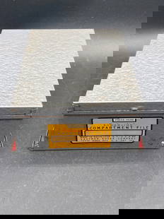 Eastman Kodak Kodaslide Compartment File: This is a Kodaslide Compartment File by Eastman Kodak Company, made in Rochester, NY, USA. It features a gray metal exterior with red plastic sorting compartments. Designed to hold photographic