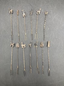 Thirteen Peruvian Sterling Silver Hors d'Oeuvres Forks with Ornamental Designs