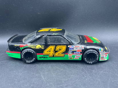 1991 Racing Champions No. 42 Mello Yello Kyle Petty NASCAR Diecast: 1991 Racing Champions 1/24 scale diecast model car featuring the No. 42 Mello Yello Kyle Petty NASCAR design. This model includes detailed sponsor decals, intricate paintwork, and features the NASCAR