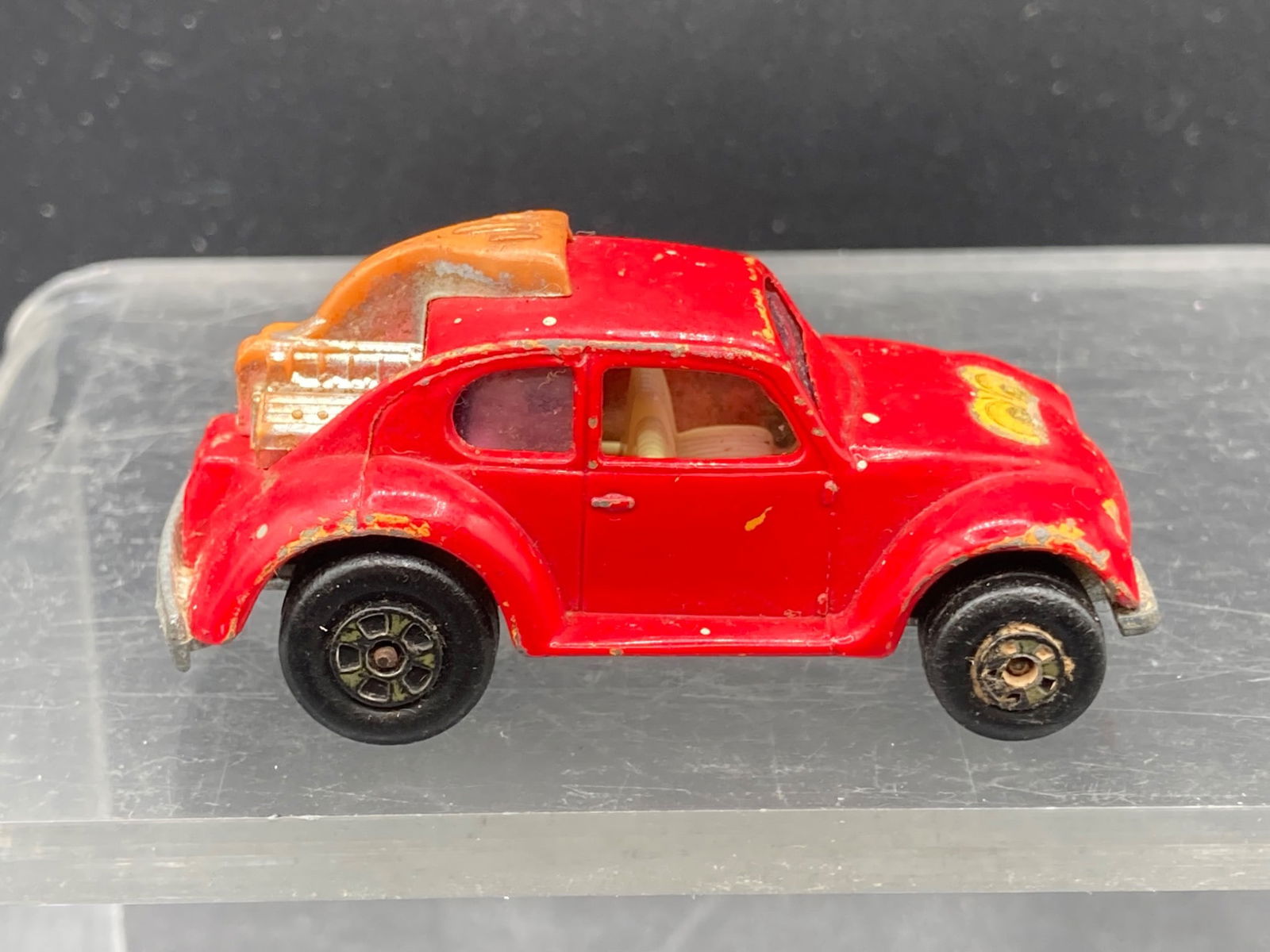 1971 Matchbox Lesney No. 31 Volks-Dragon Die-Cast Metal Car: This is a 1971 Matchbox No. 31 Volks-Dragon die-cast metal car produced by Lesney Products & Co. Ltd., made in England. 1/64 scale size. The car is red and features a rear-mounted engine design with v