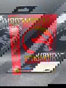 Mortal Kombat Sega Genesis Game with Original Case: This is a Mortal Kombat video game cartridge for the Sega Genesis console. Manufactured by Acclaim Entertainment in 1993, comes with its original case and cartridge. The cartridge shows visible wear w