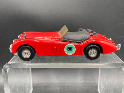 Corgi 1:34 Jaguar XK120 Die-Cast Model Car with HKV500 Plates: Corgi 1:34 scale Jaguar XK120 die-cast scale model car featuring red body paint with '56 Liege Rome Liege' racing decals and license plate 'HKV500'. Includes detailed chrome accents, a simulated inter