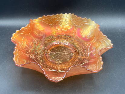 Carnival Glass Marigold Lotus & Dragon Bowl: This is a Carnival Glass bowl in the Marigold color, featuring the Lotus & Dragon pattern. The ruffled edge design enhances its aesthetic appeal. The detailed motif on the interior includes lotus flow
