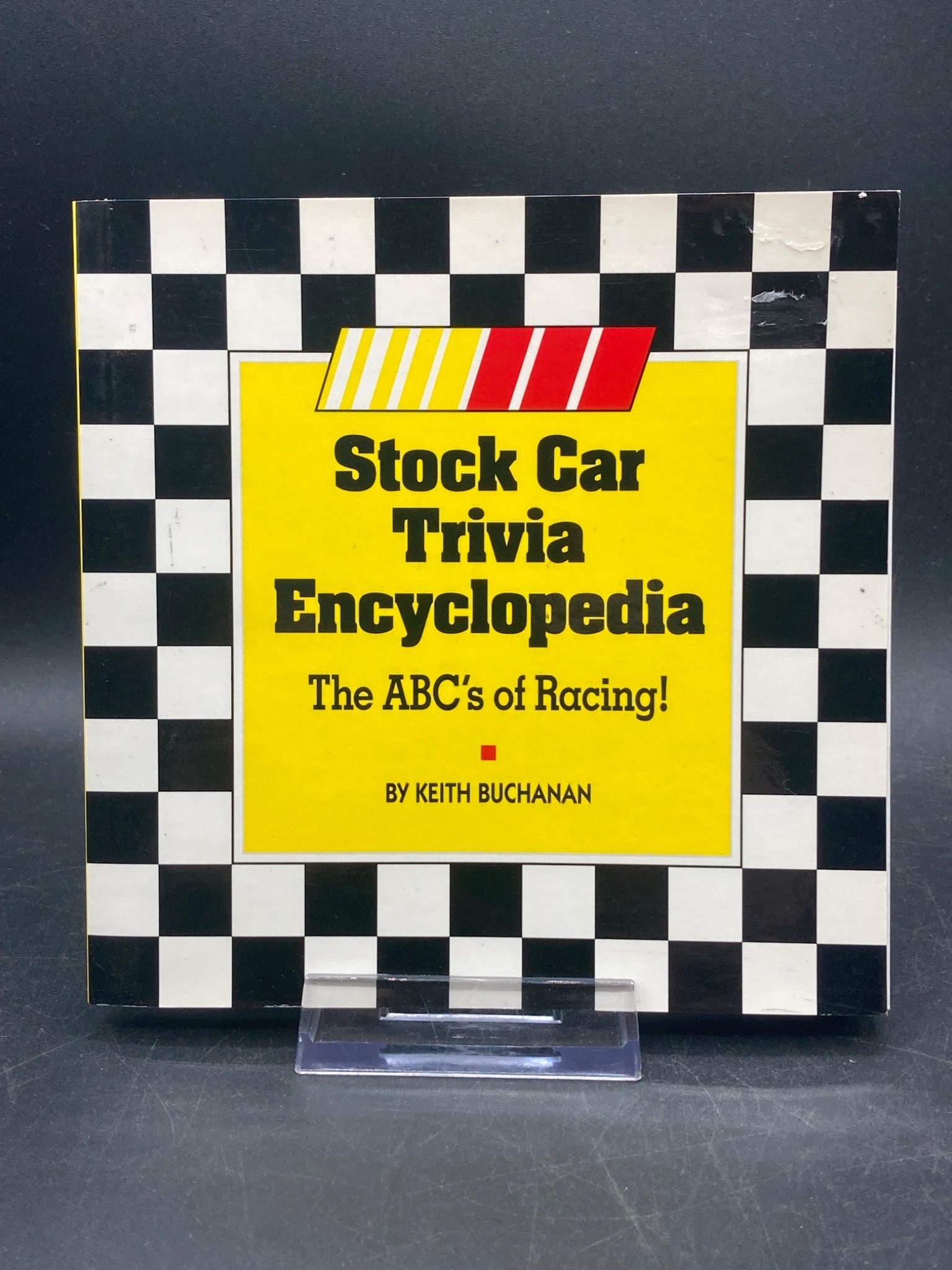 Stock Car Trivia Encyclopedia: The ABC’s of Racing! by Keith Buchanan: This is a softcover book titled 'Stock Car Trivia Encyclopedia: The ABC's of Racing!' authored by Keith Buchanan. It provides trivia, facts, and detailed information on stock car racing. ISBN: 1-88349