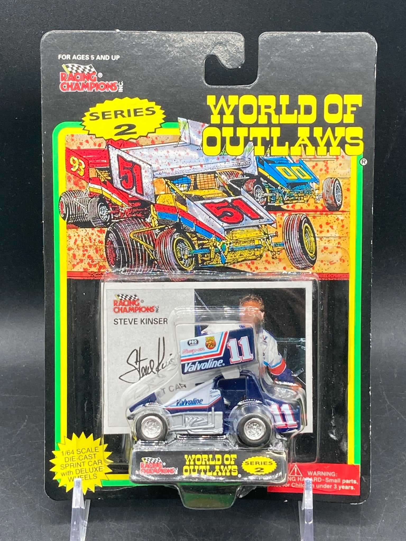 Racing Champions 1/64 Scale World Of Outlaws Steve Kinser Sprint Car Die Cast: This listing features a Racing Champions 1/64 scale die-cast replica of Steve Kinser's Sprint Car, part of the World of Outlaws Series 2. The packaging remains factory-sealed and exhibits the official