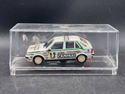 Vitesse 1/43 Lancia Delta 4WD Monte Carlo 1988 Rally Die Cast: This is a Vitesse 1/43 scale die-cast model of the Lancia Delta 4WD Rally car as used in the 1988 Monte Carlo Rally. The model features comprehensive sponsor decals, including 'Campari' and 'Italcomma