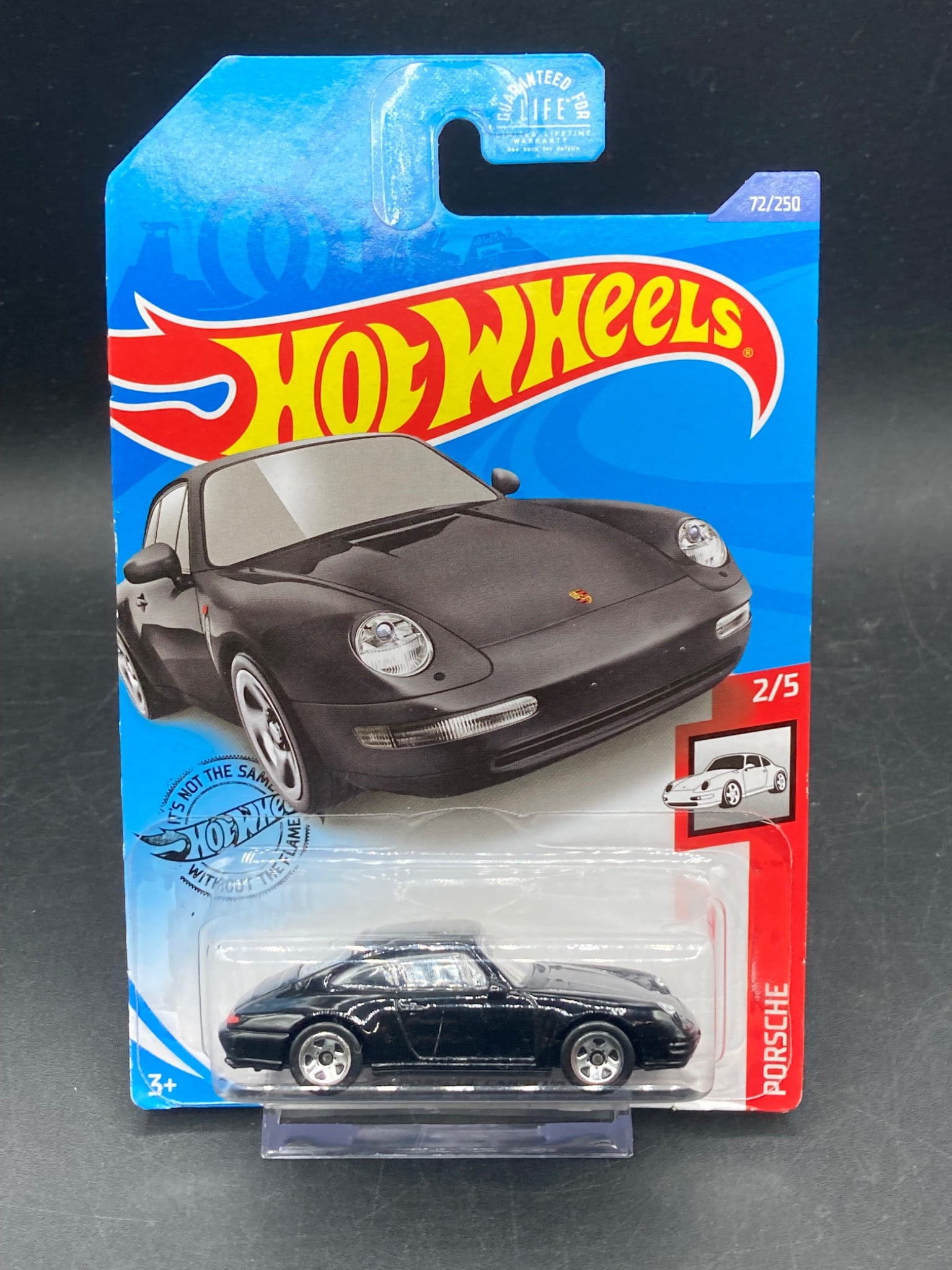 Hot Wheels 1996 Porsche Carrera Die-Cast Model (GHD19-0900C): Hot Wheels die-cast model of the 1996 Porsche Carrera. 1/64 scale. This item is part of the Hot Wheels series, labeled as 2/5 in its collection and produced under model number GHD19-0900C. The car is 