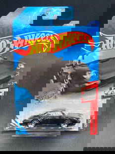 Hot Wheels 1996 Porsche Carrera Die-Cast Model (GHD19-0900C): Hot Wheels die-cast model of the 1996 Porsche Carrera. 1/64 scale. This item is part of the Hot Wheels series, labeled as 2/5 in its collection and produced under model number GHD19-0900C. The car is
