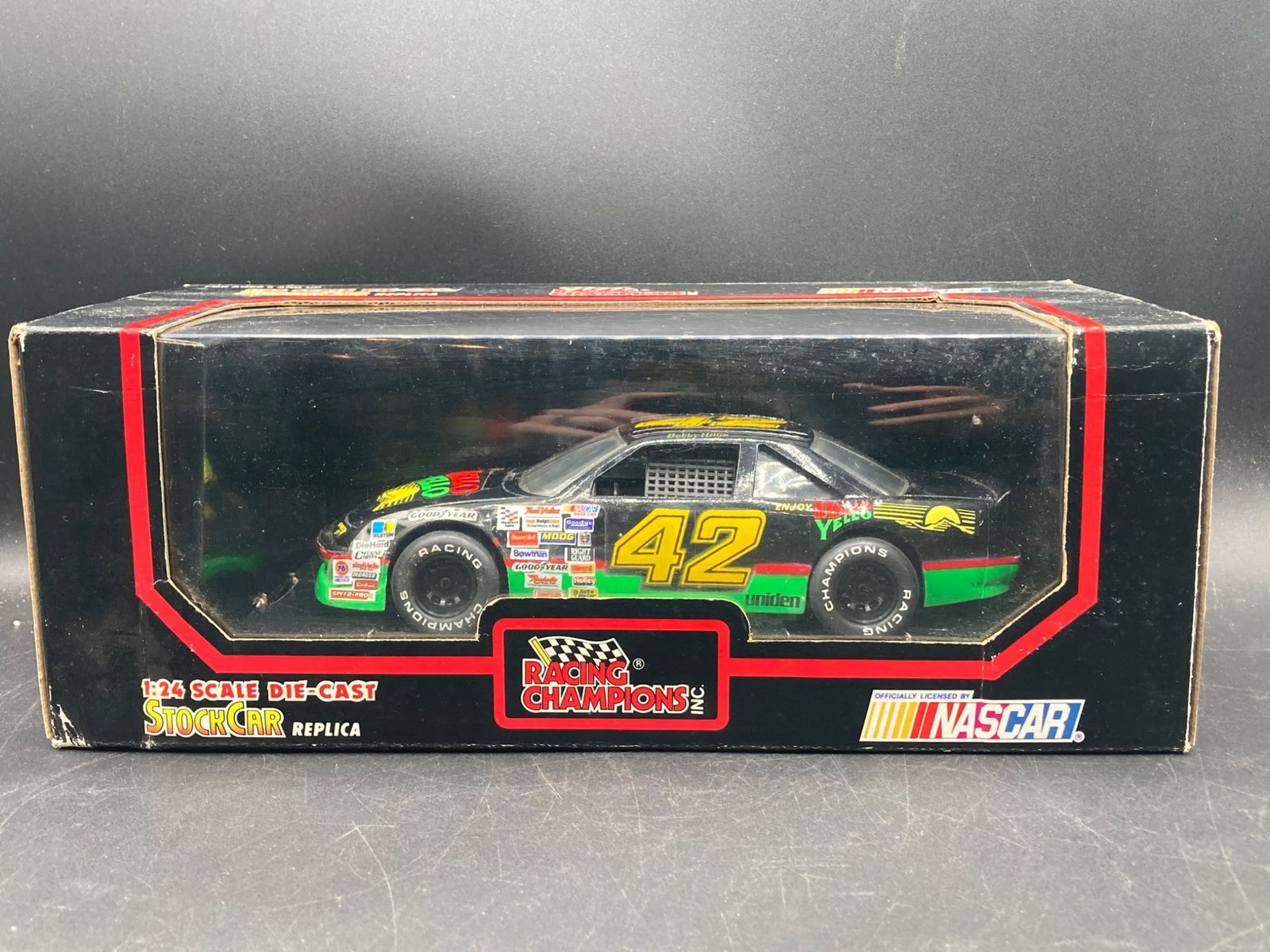 Racing Champions 1/24 Bobby Hillin Mello Yello #42 NASCAR Die Cast Model: This is a 1/24 scale die-cast NASCAR model produced by Racing Champions. The car, driven by Bobby Hillin, features the iconic #42 Mello Yello design, showcasing detailed sponsor logos and authentic ra