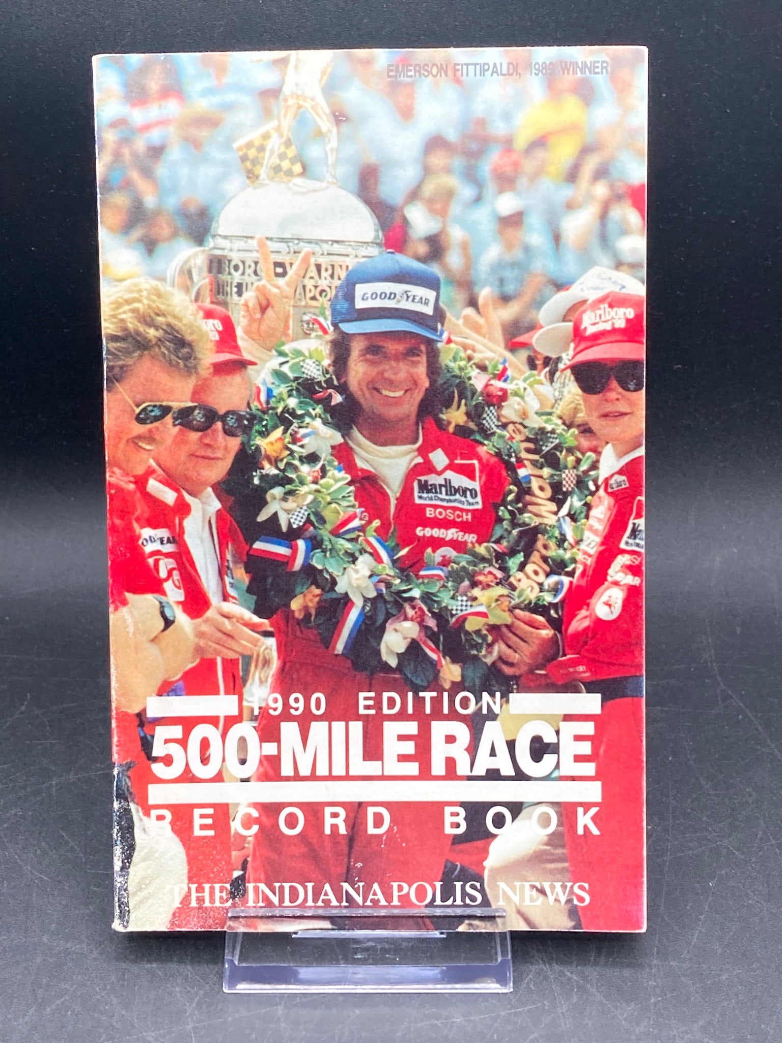 1990 Indianapolis 500-Mile Race Record Book by Bill Pittman: This 1990 edition of the 500-Mile Race Record Book, authored by Bill Pittman, contains comprehensive details and records of the Indianapolis 500 up to 1990. Published by Indianapolis Newspapers, Inc.,