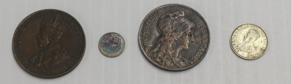 FOREIGN COIN LOT: FOREIGN COIN LOT 1922 AUSTRALIA 3 PENCE, 1915 GREAT BRITAIN PENNY, 1924 COMMWEALTH OF AUSTRALIA PENNY, AND 1907 FRANCE 10 CENTIMES