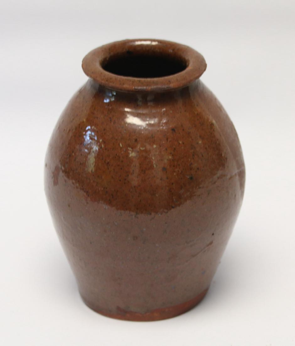 SMALL REDWARE OVOID JAR (1 of 3)
