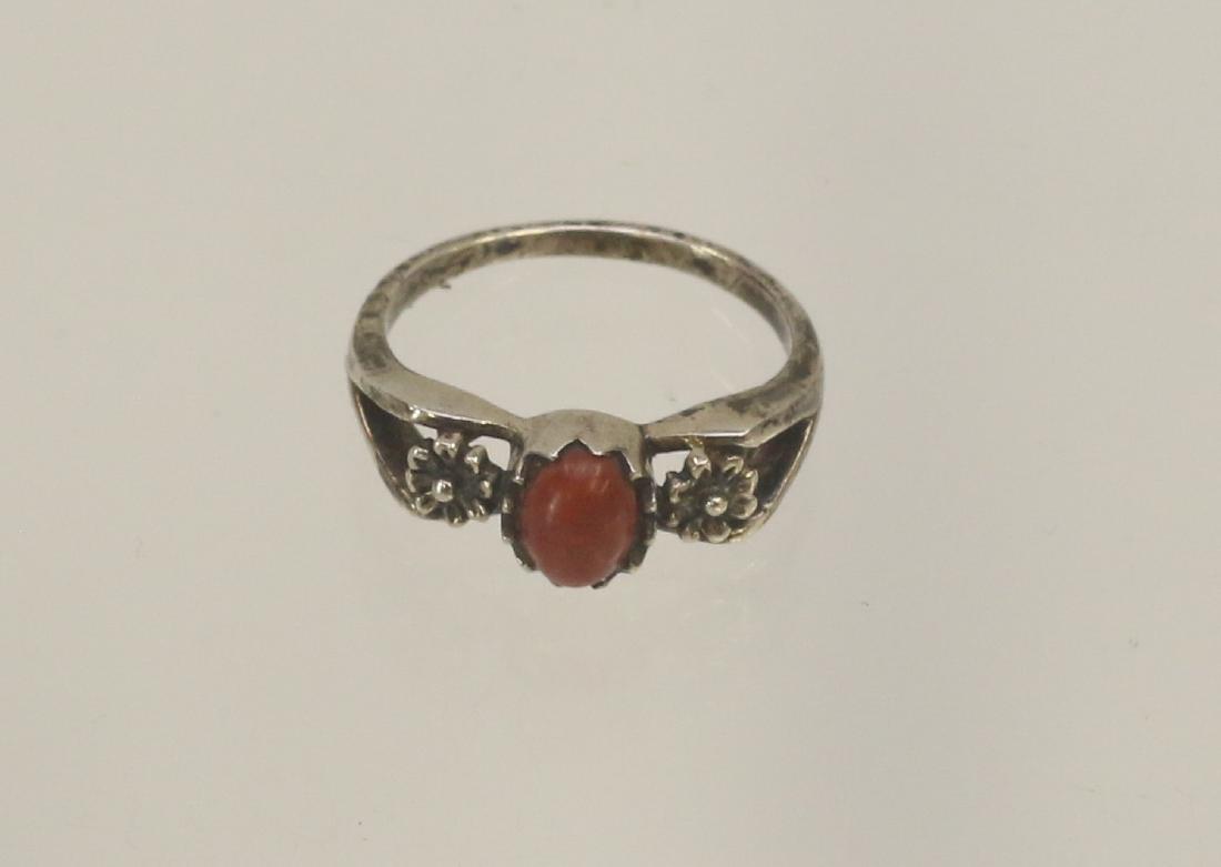 STERLING SILVER AND CARNELIAN RING: OVAL CARNELIAN WITH FLORAL DESIGN