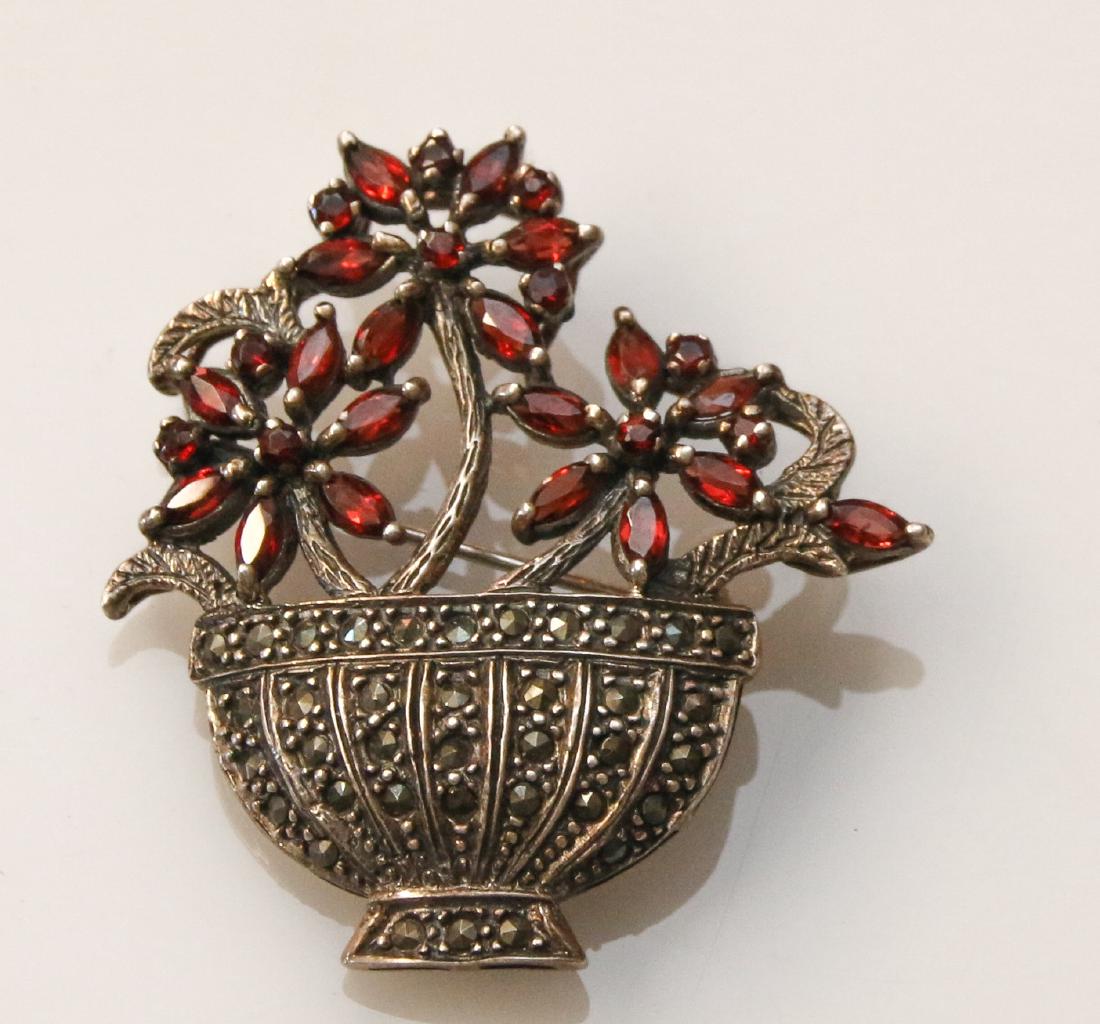 STERLING AND MARCASITE BROOCH: WITH GARNETS Dimensions: 1 3/4" DIAMETER