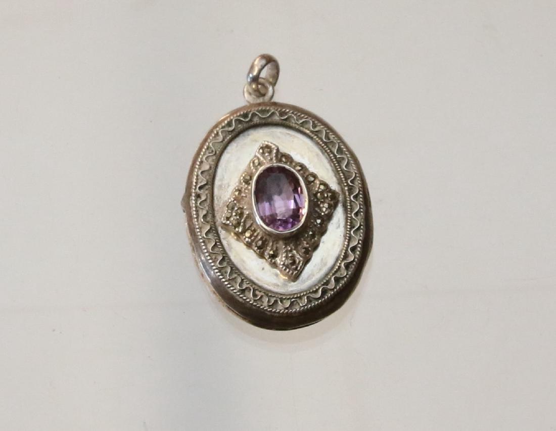 STERLING AND MARCASITE LOCKET: HINGED LOCKET WITH AMETHYST - .5OZT Dimensions: 1 1/2" X 1"
