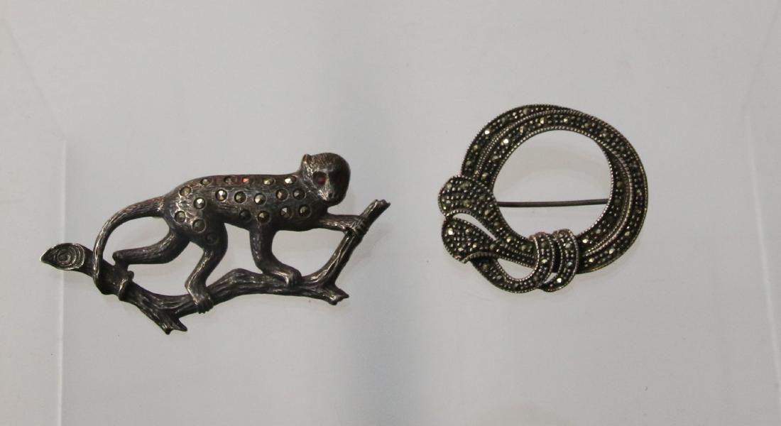 STERLING AND MARCASITE BROOCH: MONKEY AND CIRCLE - .56 OZT Dimensions: 3/4" X 2"