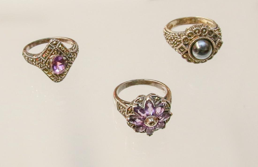 3 - STERLING AND MARCASITE RINGS: MARCASITE, AMETHYST, AND FAUX PEARL .925 - .60 OZT Dimensions: SIZES (2) 7 - (1) 8.5