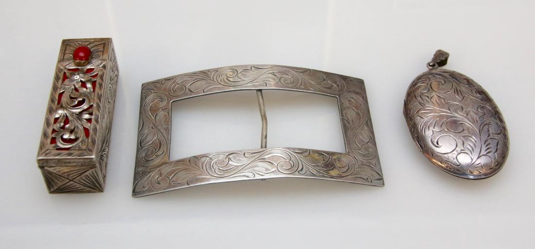 STERLING LOT: ALL BRIGHT CUT ENGRAVED BUCKLE - STERLING AND .900 SILVER - LARGE LOCKET AND LIPSTICK - 2.31 OZT Dimensions: 3" AND 2"