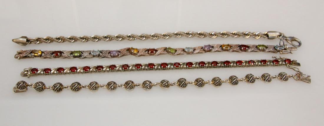 4 - STERLING BRACELETS: 1.56 OZT - GARNETS, RHINESTONES, AND MARCASITE Dimensions: 7"