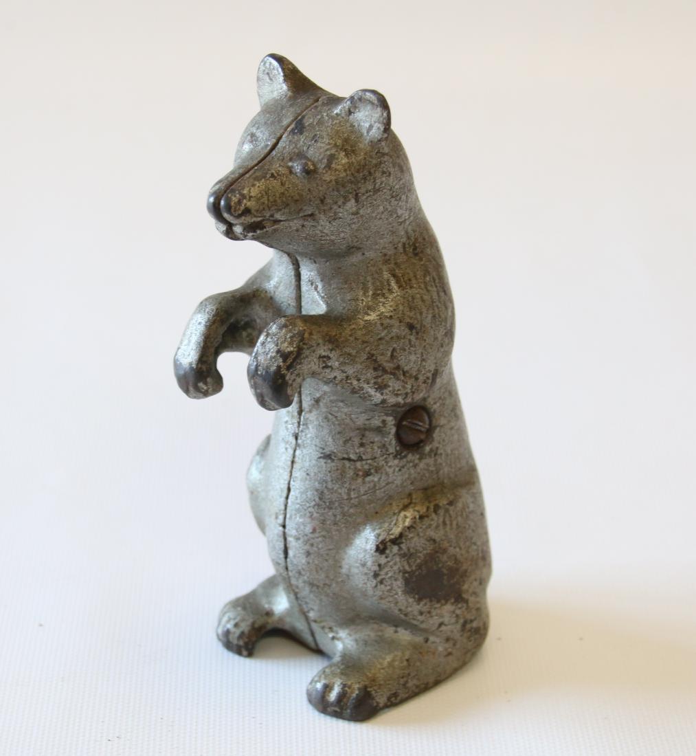 CAST IRON STILL BANK: IN THE FORM OF A BEAR - ORIGINAL SILVER PAINT