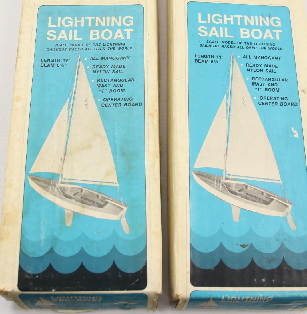 2-Dumas boats: 2-Lightning sail boats, 19" x 6 1/2"