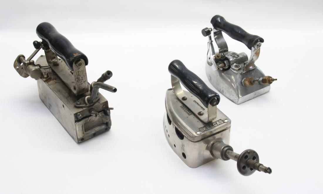GROUP LOT OF IRONS: PATRICK DULUTH TAILOR IRON, INDUSTRIAL STEAM IRON, AND SKELGAS LIQUID IRON 7 1/2" TO 10"