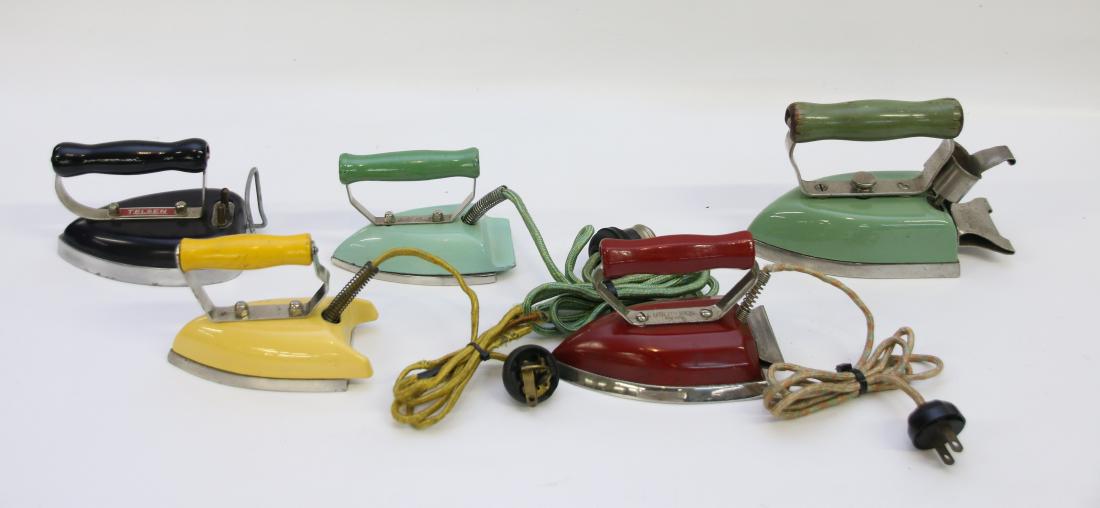 GROUP LOT OF TRAVEL IRONS: (5) INCLUDING - YELLOW PORCELAIN ELECTRIC, SAMPSON PANELMATIC JR. IN RED ENAMEL, "GOLD SEAL" IN GREEN PORCELAIN, "TELSEN" IN BLACK/ DARK BLUE, "LITTLE PRINCESS" IN GREEN PORCELAIN 4 3/4" TO 5 1/4"