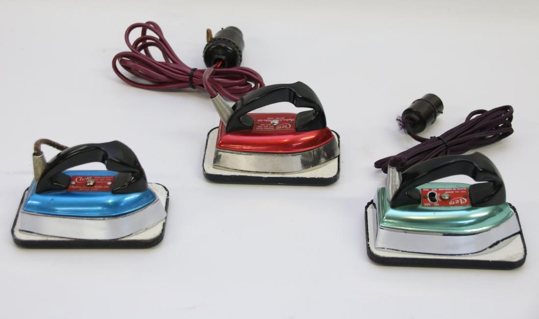 GROUP LOT OF TRAVEL IRONS: (3) INCLUDING - "CLEM" IRONS IN RED, BLUE, AND GREEN WITH RESTS 4 1/4"