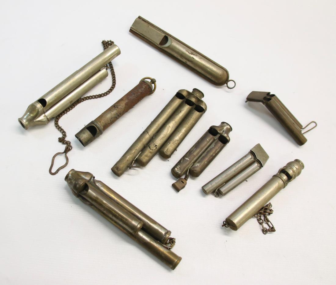 GROUP LOT OF VINTAGE WHISTLES: (9) BRASS AND NICKEL WHISTLES WITH DIFFERENT SHAPES AND SOUNDS - MOSTLY TRAIN WHISTLES 3 1/2" TO 6"
