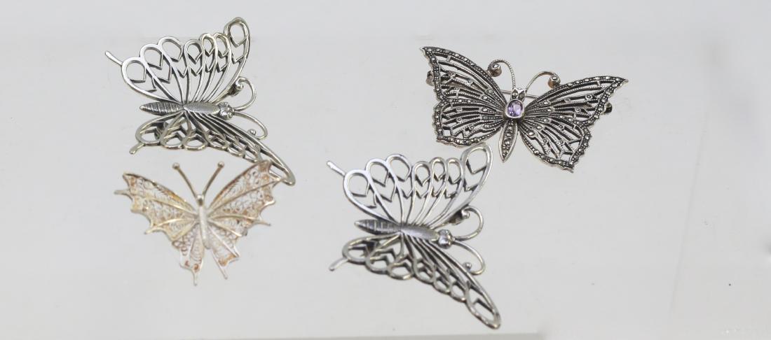 (4) STERLING BUTTERFLIES: (4) BROOCHES AND ONE WITH MARCASITE . DIMENSIONS: (3) 1 1/4" X 2" - 1" X 1 1/2"