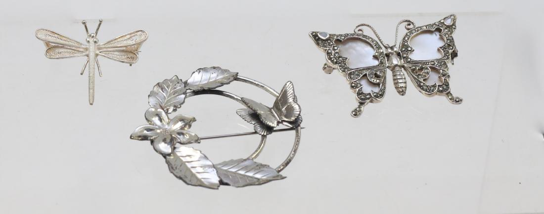 (3) STERLING BUTTERFLIES: MOTHER OF PEARL AND MARCASITE - FILIGREE DRAGONFLY - CIRCLE AND BUTTERFLY . DIMENSIONS: 2" DIAMETER