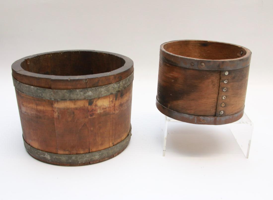 PAIR OF WOODEN MEASURES: (2) METAL BANDED DRY MEASURES . DIMENSIONS: 3 3/4" X 5 1/2" - 7 1/4" X 5 1/4"