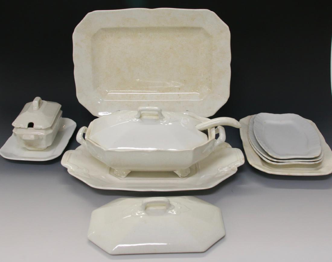 LARGE IRONSTONE GROUPING: WHITE IRONSTONE GROUPING INCLUDING - TUREEN, LADLE, UNDER TRAY, (6) PLATTERS, HOT WATER PITCHER, AND COVERED SUGAR Dimensions: PLATTERS 16" X 12" TO 10" X 7" - TUREEN 6" X 6" X 12" - VEG. 6" X 6" X 12