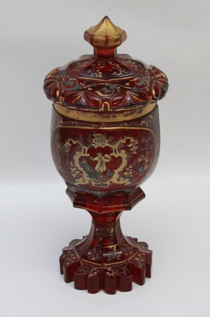 COVERED POKAL SET: CUT MOSER TYPE COVERED POKAL - COMPOSITE AND GILT WITH SILVER OVERLAY, RUBY FLASH, AND CUT HEAVY BASE Dimensions: 13" X 6"