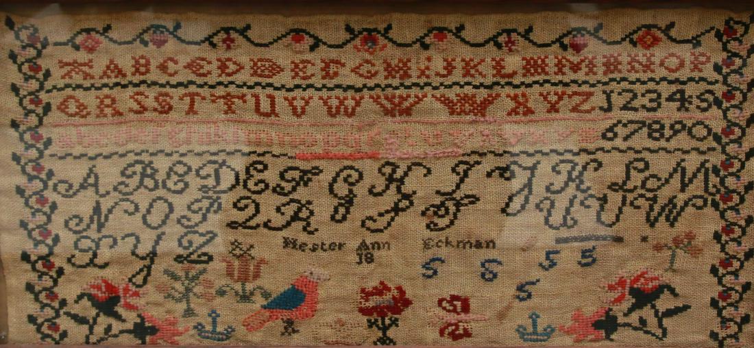 19th CENTURY SAMPLER: FRAMED UNDER GLASS - ALPHABET AND NUMERALS - BY: HESTER ANN ECKMAN Dimensions: 17 1/2" X 7 1/2"