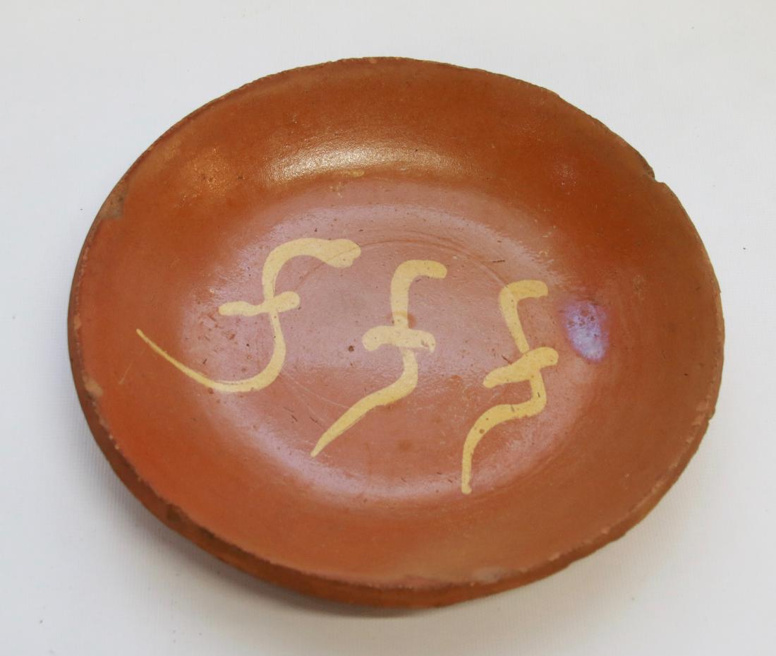 EARLY REDWARE PIE PLATE: 19TH CENTURY PA, SLIPWARE PIE PLATE WITH YELLOW DECORATION Dimensions: 8 3/4" DIAMETER