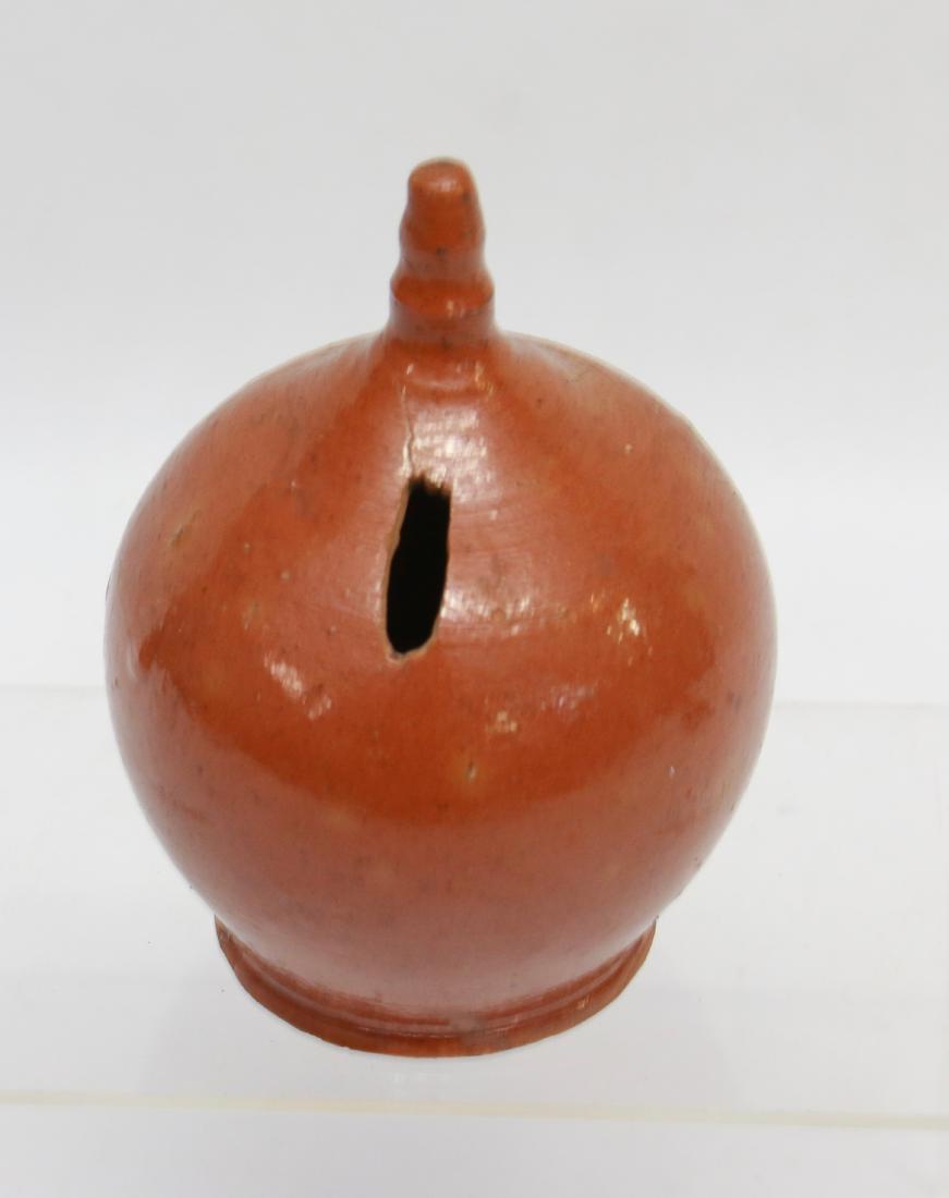 REDWARE BANK: REDWARE POTTERY BANK WITH FINIAL - UNSIGNED Dimensions: 5 1/2" H X 4" DIA