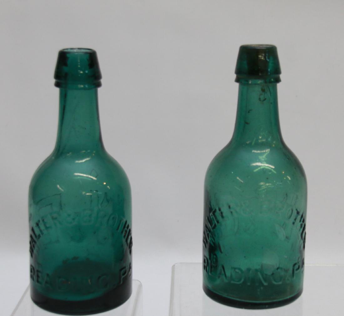 PR. OF EARLY BOTTLES: EMBOSSED "W&B" WALTER AND BROTHER - READING, PA - IN GREEN Dimensions: 6 3/4" AND 7" HIGH
