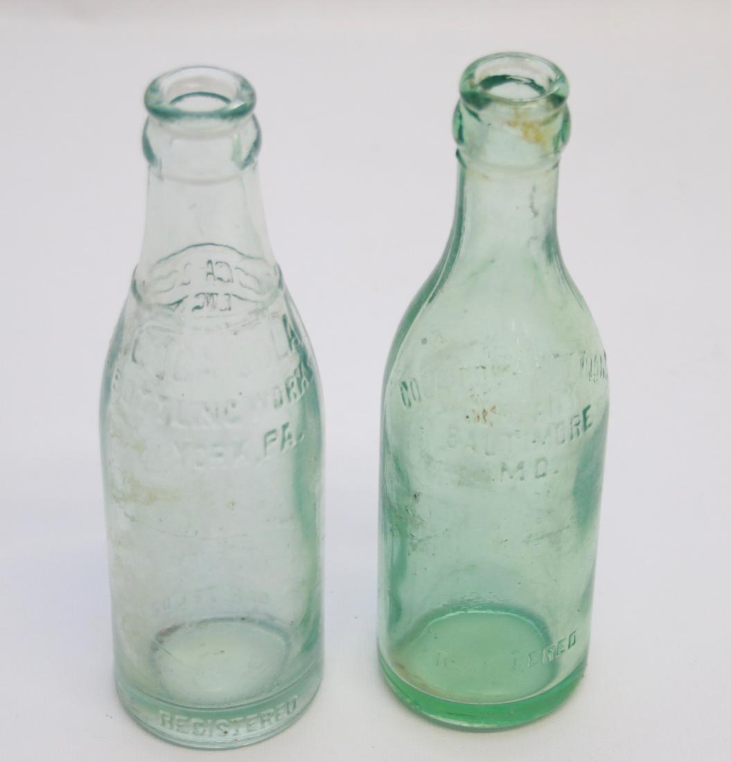 PR. OF STRAIGHT SIDED COCA COLA BOTTLES: IN GREEN AND AQUA - GREEN IS COCA COLA BALTIMORE, MD - AQUA IS COCA COLA YORK, PA Dimensions: 7 1/2"