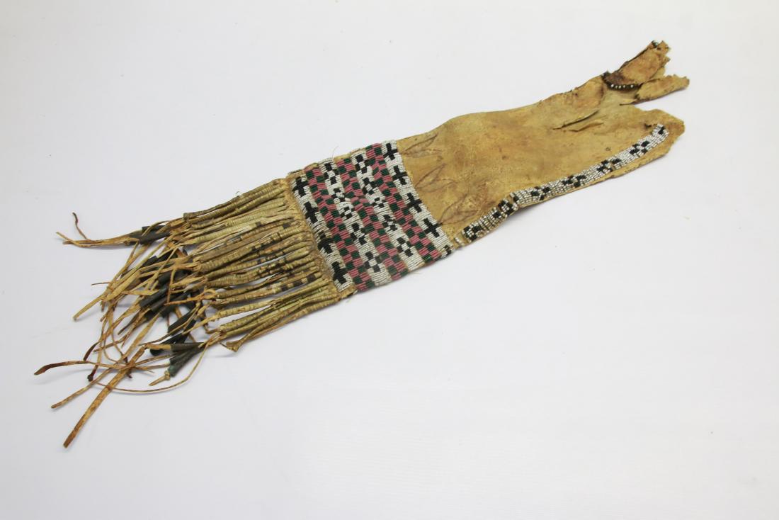 NATIVE AMERICAN PIPE BAG: DEERSKIN WITH BEADWORK - LONG FRINGE WITH METAL WORK Dimensions: 24" X 5"