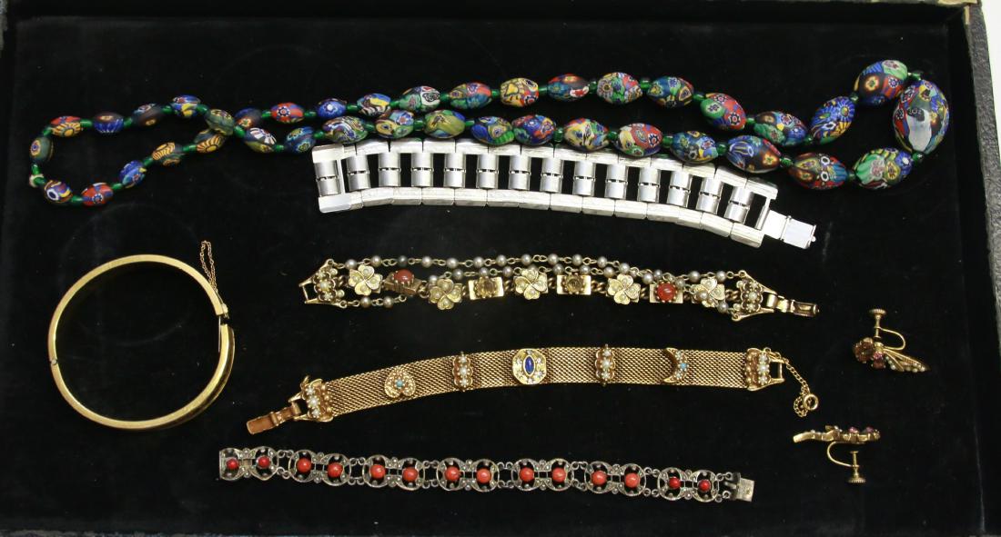 LOT OF COSTUME JEWELRY: INCLUDING - BRACELET WITH RED LAPIS, GOLD PLATED BRACELET, CHARM BRACELET, BANGLE, BRACELET MARKED "CORO", AND GLASS BEAD NECKLACE