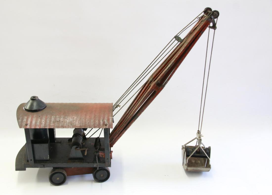 PRESSED STEEL CRANE: BLACK AND RED PAINT -"THE BIG BOY" BY: KELMET CORP., 12" X 9 1/2"