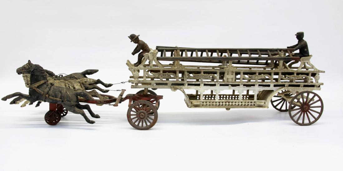 LARGE CAST IRON FIRE WAGON: (3) HORSES PULLING CAST IRON WAGON WITH 2 DRIVERS AND (2) REMOVABLE WAGONS , 30" L