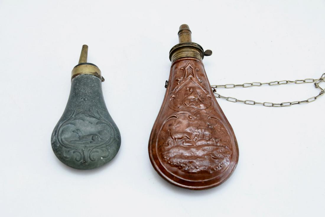 PR. OF POWDER FLASKS: (2) ANTIQUE POWDER FLASKS WITH EMBOSSED ANIMALS , 6" AND 7 1/4"