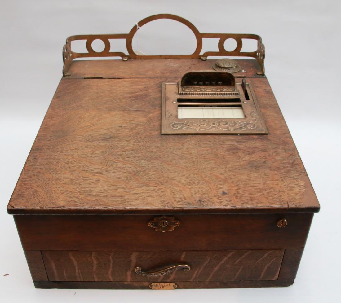 NATIONAL CASH REGISTER: OAK COUNTER CASH REGISTER WITH LIFT LID, CASH DRAWER, AD BRONZE DETAIL -#35 OR #45 MODEL - SHIPPED SEPTEMBER 25TH, 1911 TO L.W. STILES GENERAL STORE SPRINGFIELD, VT, 17" X 18 3/4" X 8 1/2"