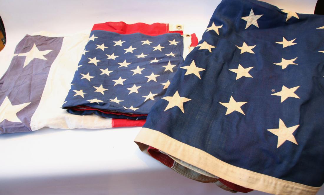 GROUP LOT OF AMERICAN FLAGS: (3) FLAGS INCLUDING - BUNTING BY; RELIANCE (4'X6') - 50 STAR BY; EVERWEAR (3'X5') - 45 STAR WOOL FLAG (74" X 118")