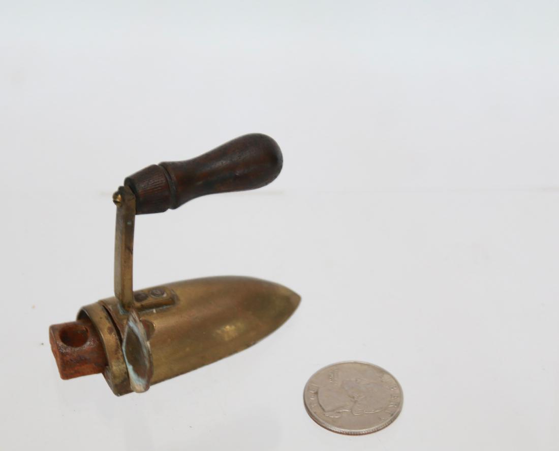 MINIATURE BRASS SLUG IRON: WITH "L" HANDLE - SWING GATE AND SLUG . 2 1/4"