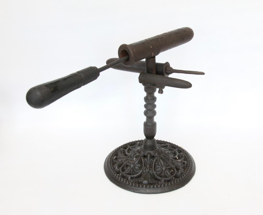 GOFFERING IRON: TRIPLE BARREL IRON ON ELABORATE BASE - WITH SOLDERING IRON AND POKER . 12"H